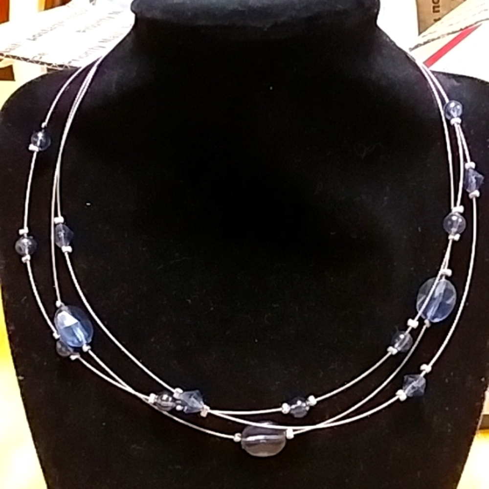 Blue bead and silver necklace.